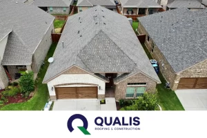 An aerial view of a house with the words quaalis on it, showcasing the excellent roofing services provided by a reputable roofing company based in Dallas.